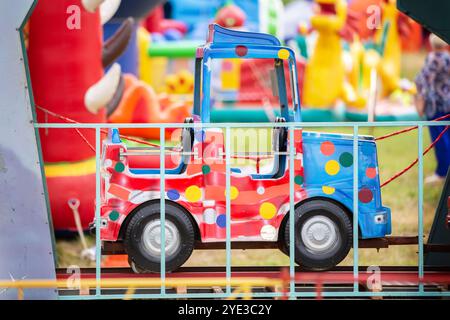 Children's colorful carousel car in the park. Stock Photo