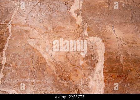 Background photography of beige marble slab, part of old house wall in Mallorca, Spain,  abstract pattern; textured surface, marble veins Stock Photo