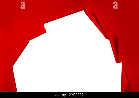 A paper red torn background from which a white wall is visible. The photo zone in the photo studio. Stock Photo
