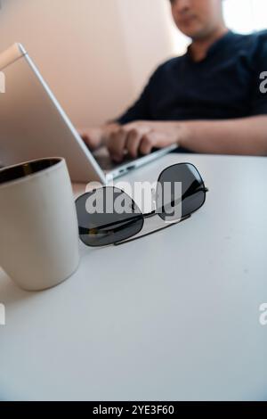 Close-up photo of a programmer typing on a laptop Stock Photo