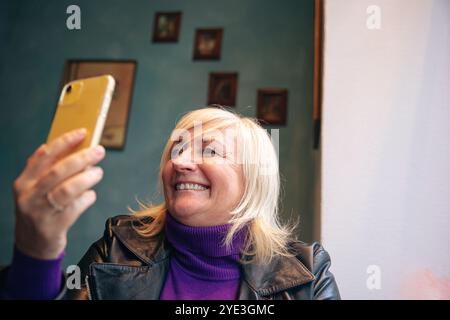 Smiling woman with white hair in a good mood Stock Photo