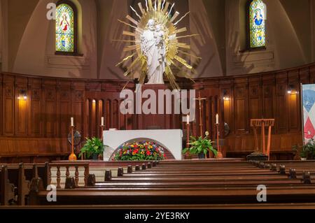 The historic interior and altar in Saint Joseph's Oratory of Mount Royal in Montreal Canada on a sunny day. Stock Photo