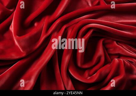 Chiffon,satin and shiny material. top view. pleats made of light fabric. wedding and luxurious backdrop.Red luxurious background, the red velvet. Stock Photo