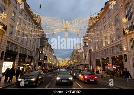 London, UK - 1st Dec 2019: Christmas decorations in the streets of Piccadilly and Mayfair, central London, UK. Bust street with tourists and cars in t Stock Photo