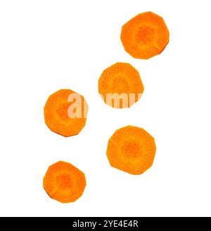 Pieces of falling round carrot slices isolated on white, clipping path Stock Photo