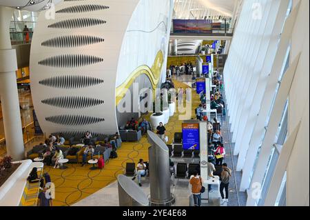 ABU DHABI - SEPT 20: View of interior new Zayed International Airport terminal with passengers in Abu Dhabi on September 20. 2024 in UAE. Stock Photo