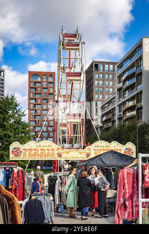 Stallholders chatting at the Classic Car Boot Sale, Granary Square, King's Cross, London, UK Stock Photo