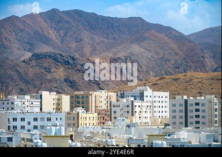 View of Muscat with traditional white small buildings and mountains, Oman Stock Photo