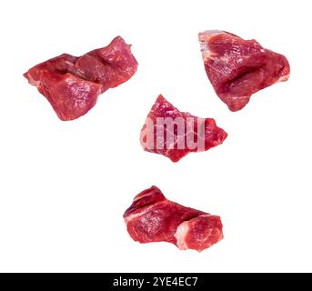 Four slices of falling raw beef meat isolated on white, clipping path, Stock Photo