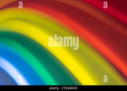 Blurry closeup of colors forming an arched rainbow. Art background Stock Photo