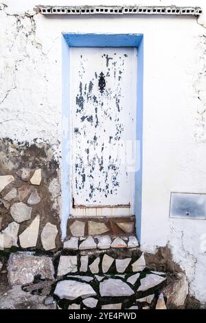 Old wooden door with white peeling paint Stock Photo