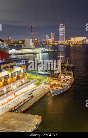 Nightscape of illuminated buildings including a replica Santa Maria tall ship in Osaka Port, Japan on 27 September 2024 Stock Photo