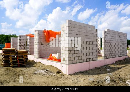 Wall construction of a new residential house from expanded clay blocks with thermally insulated foundations Stock Photo
