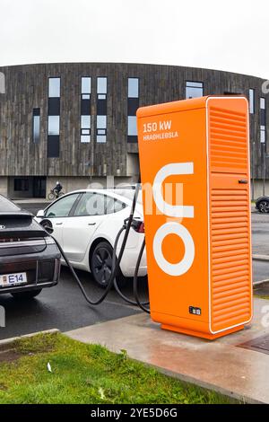 Akureyri, Iceland - 24 August 2024: Electric cars plugged into a rapid vehicle charging station near the city centre Stock Photo