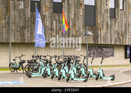 Akureyri, Iceland - 24 August 2024: Electric scooters for hire parked outside the city's tourist information centre Stock Photo