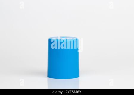 Cyan plastic cylindrical cap, cylinder shaped object, isolated on white background. Stock Photo