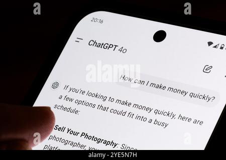 ChatGPT conversation on smartphone screen discussing ways to make money quickly through various options and tips. Stafford, United Kingdom, October 29 Stock Photo