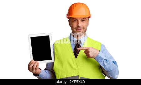 Builder Showing Tablet Computer Pointing Finger At Screen, White Background Stock Photo