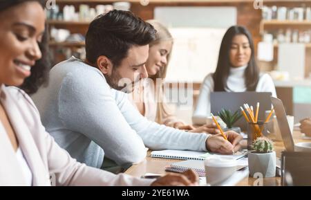 Working process of young multiracial business team Stock Photo