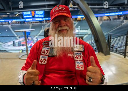 A supporter of Trump shows of his loyalty. Former President and 2024 Republican presidential nominee attends a rally at the McCamish Pavilion on the c Stock Photo