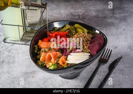 Buckwheat salad with capers, salmon and pickles. Healthy eating concept Stock Photo