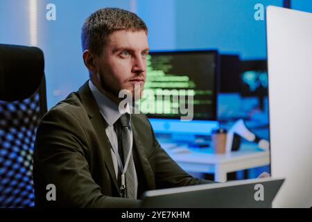 Serious Specialist Monitoring Security System Stock Photo