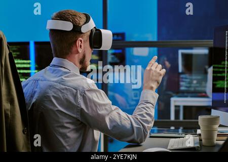 Male Specialist Using Virtual App At Work Stock Photo