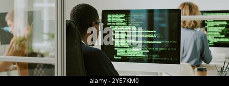 Unrecognizable Black Man Coding on Computer Website Banner Stock Photo