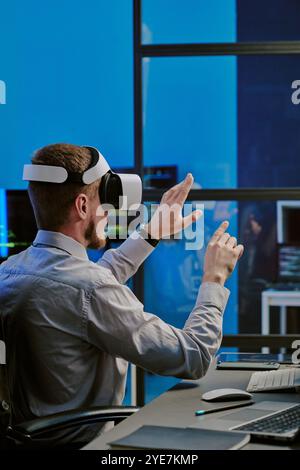 Man Using Virtual Technologies At Work Stock Photo