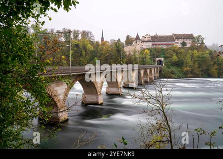 Rheinbrücke bei Laufen bridge at the beautiful Swiss Rhine Falls, seen during the fall time. Stock Photo