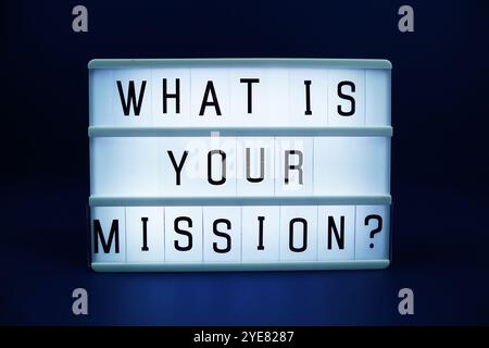 What is your mission? letterboard text on LED Lightbox on blue background Stock Photo