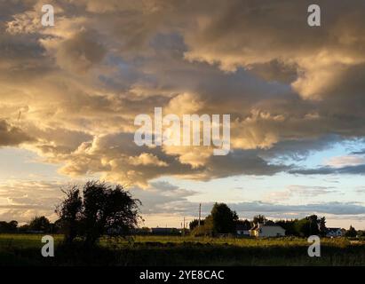 A stunning cloud formation over farmland on an autumn evening at sunset Stock Photo