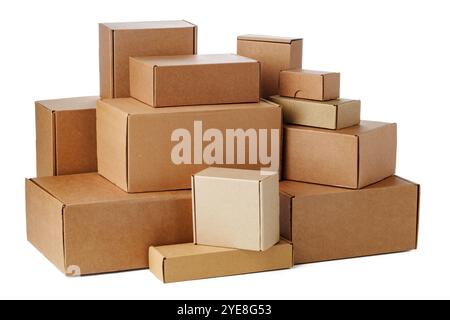 Stacked brown cardboard boxes in various sizes arranged on a white background Stock Photo