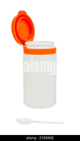 Concept. White plastic medicine bottle with open red lid. There is a plastic spoon. Isolated on white. Stock Photo