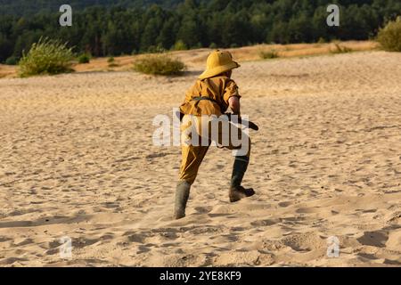 Reconstruction siege of Tobruk durind WWII. Italian infantry soldier attack enemy positions in the desert.  Błędów desert, Silesia, Poland Stock Photo