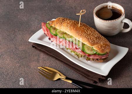 Sandwich with sausage, cucumber, melted cheese and lettuce Stock Photo ...