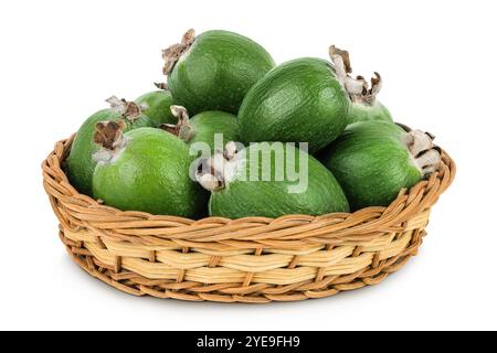 Feijoa fruit in a wicker basket isolated on white background Stock Photo