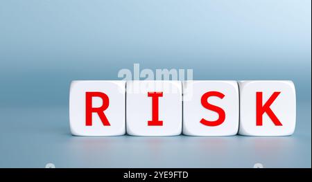 Four white cubes composing the word risk on blue background 3d Stock Photo