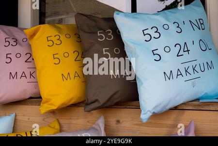 Decorative pillows with geographical coordinates, souvenirs of small town of Makkum, Friesland, Netherlands Stock Photo