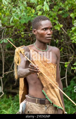 Hadzabe hunter with a squirrel he has shot for food near Lake Eyasi, Tanzania; Tanzania Stock Photo