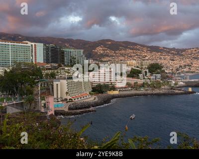 Hotels with a waterfront view in the coastal town of Funchal on the island of Madeira, Portugal; Funchal, Madeira, Portugal Stock Photo