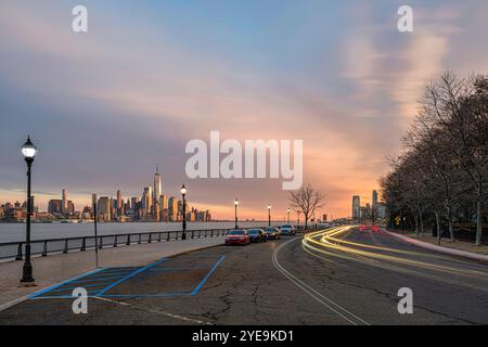 Lower Manhattan and Jersey City skylines at sunset viewed from Hoboken, NJ, USA; Hoboken, New Jersey, United States of America Stock Photo