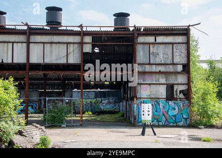 Yorkshire, UK – 18 May 2024: A security camera stands in the yard of the abandoned factory complex Hepworth Refractories brickworks, Sheffield Stock Photo