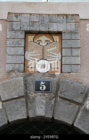 Modern or Contemporary Stone Mosaic Showing Person Reading a Book at Entrance to Bookshop Digne or Digne-les-Bans Provence France Stock Photo