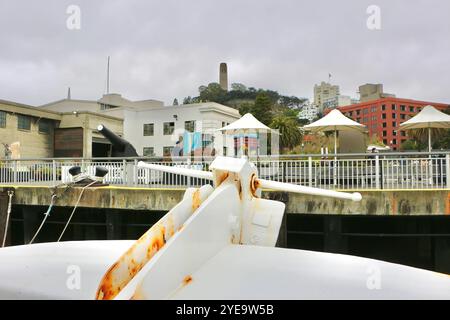 Leaving Pier 33 in reverse on board the Alcatraz Clipper tour boat with the iconic Coit Tower San Francisco California USA Stock Photo