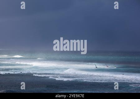 Windsurfers at Ho'okipa Beach, Maui, Hawaii, USA; Maui, Hawaii, United States of America Stock Photo