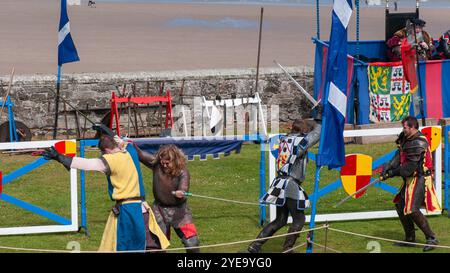 3 Knights in Chainmail Swordfighting in Reenactment at Banburgh Castle ...