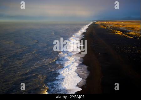 Spectacular vista of The Endless Black Beach in Dyrholaey; Dyrhólaey, Katla Geopark, Iceland Stock Photo