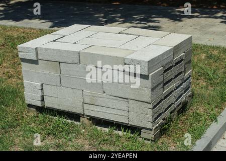 Expanded clay concrete building blocks are stacked on a standard wooden pallet Stock Photo