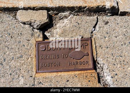 Boston, MA - Sept. 9, 2024: This 'Don't Dump Drains to Boston Harbor' sign includes the logo for the Boston Water and Sewer Commission. Stock Photo